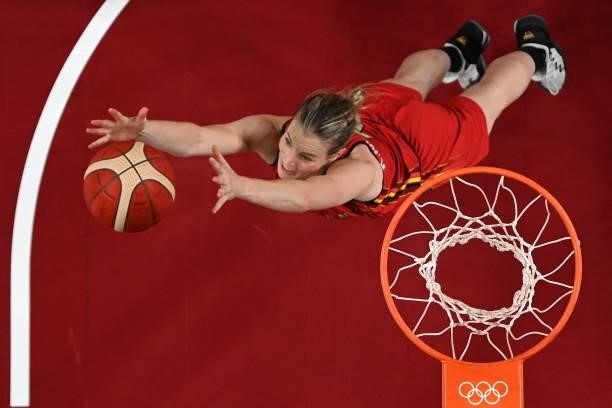 Belgium's Kim Mestdagh dives to catch the ball in the women's preliminary round group C basketball match between Australia and Belgium during the...