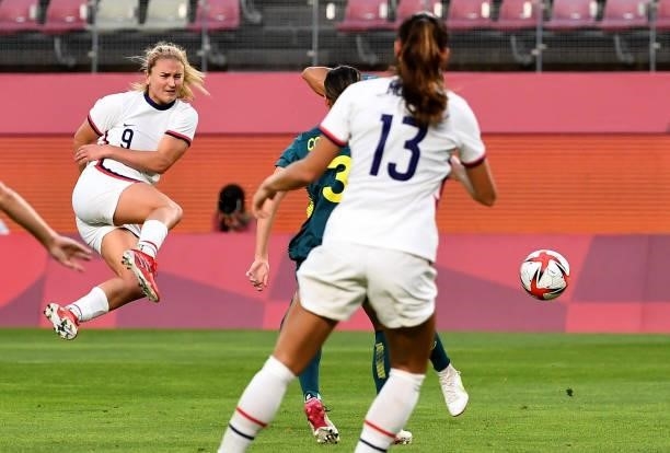 S midfielder Lindsey Horan shoots in a volley during the Tokyo 2020 Olympic Games women's group G first round football match between USA and...