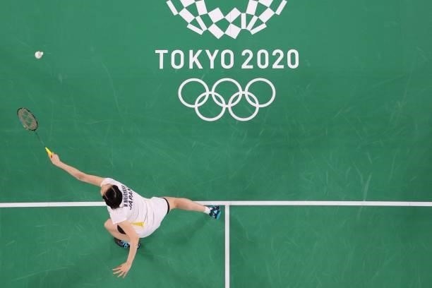 Japan's Wakana Nagahara hits a shot next to Japan's Mayu Matsumoto in their women's doubles badminton group stage match against Netherlands' Cheryl...