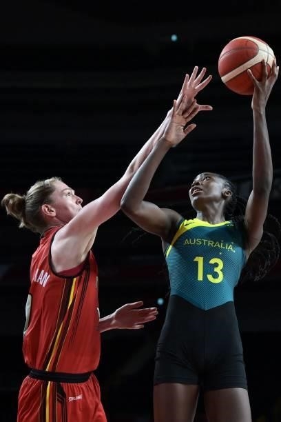 Australia's Ezi Magbegor shoots the ball as Belgium's Emma Meesseman tries to block in the women's preliminary round group C basketball match between...