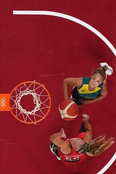 Belgium's Julie Allemand and Australia's Alanna Smith fight for a rebound in the women's preliminary round group C basketball match between Australia...