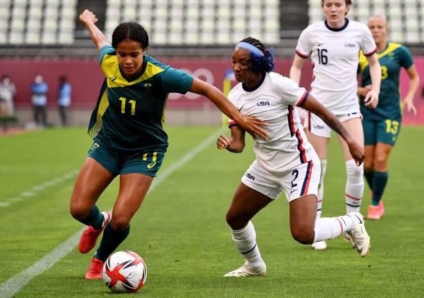 Australia's forward Mary Fowler dribbles the ball past USA's defender Crystal Dunn during the Tokyo 2020 Olympic Games women's group G first round...