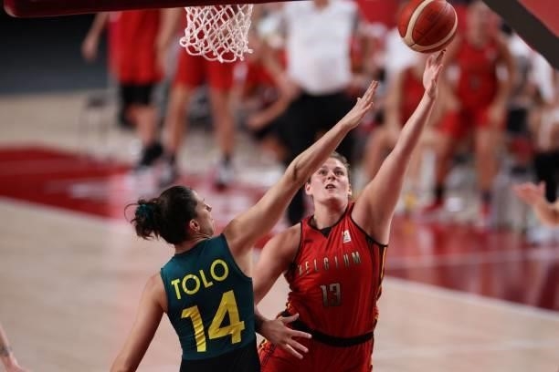 Belgium's Kyara Linskens goes to the basket past Australia's Marianna Tolo in the women's preliminary round group C basketball match between...