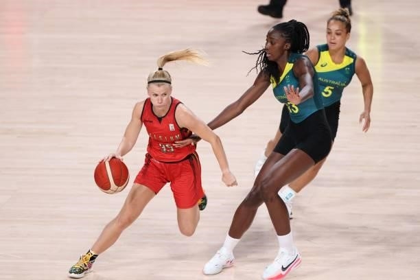 Belgium's Julie Vanloo dribbles the ball past Australia's Ezi Magbegor in the women's preliminary round group C basketball match between Australia...