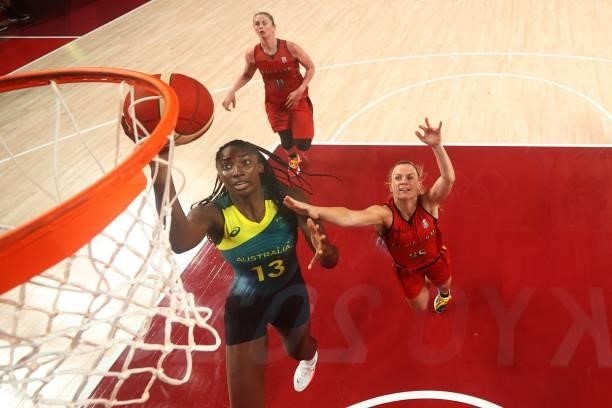 Australia's Ezi Magbegor goes to the basket past Belgium's Julie Vanloo in the women's preliminary round group C basketball match between Australia...