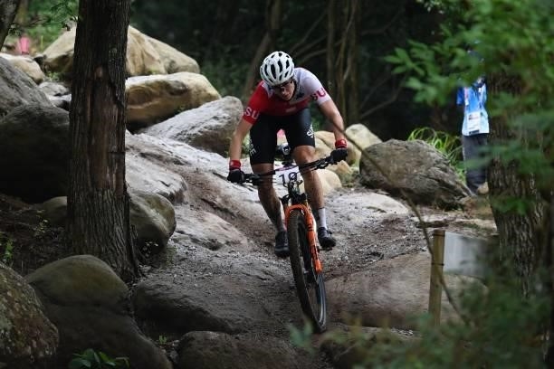 Switzerland's Linda Indergand rides in the cycling mountain bike women's cross-country race during the Tokyo 2020 Olympic Games at the Izu MTB Course...