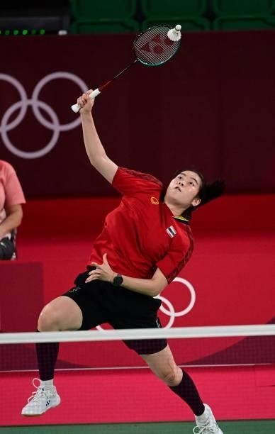 Thailand's Busanan Ongbamrungphan hits a shot to Estonia's Kristin Kuuba in their women's singles badminton group stage match during the Tokyo 2020...
