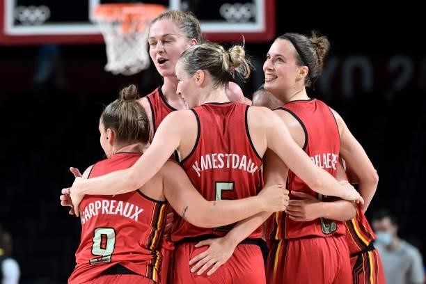 Belgium's players celebrate after their win in the women's preliminary round group C basketball match between Australia and Belgium during the Tokyo...