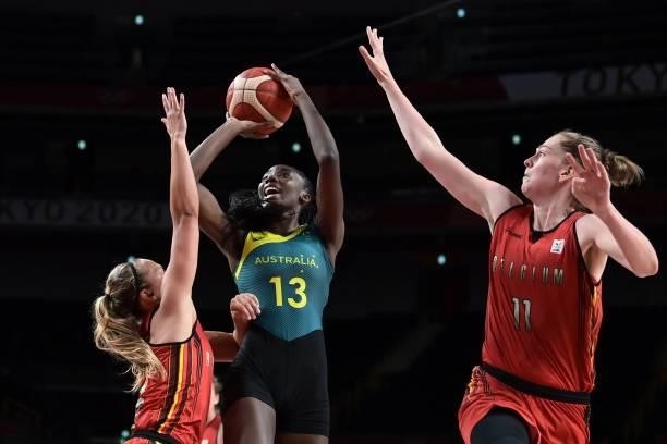 Australia's Ezi Magbegor shoots the ball past Belgium's Emma Meesseman in the women's preliminary round group C basketball match between Australia...