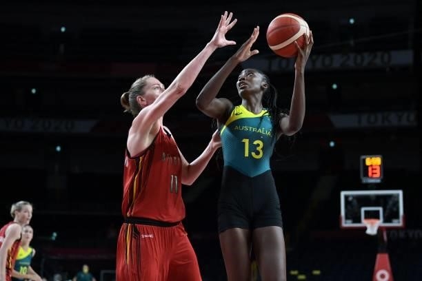 Australia's Ezi Magbegor shoots the ball as Belgium's Emma Meesseman tries to block in the women's preliminary round group C basketball match between...