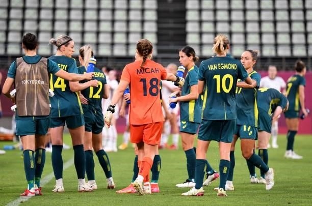 Australia's football players take a water break during the Tokyo 2020 Olympic Games women's group G first round football match between USA and...