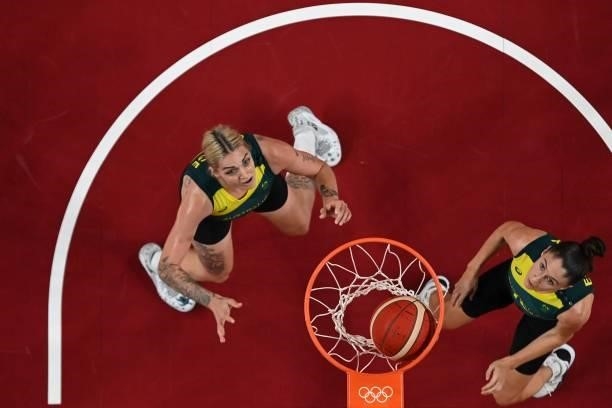 Australia's Cayla George and Katie Ebzery look at the basket in the women's preliminary round group C basketball match between Australia and Belgium...