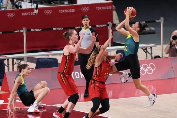Australia's Katie Ebzery goes to the basket past Belgium's Julie Allemand in the women's preliminary round group C basketball match between Australia...