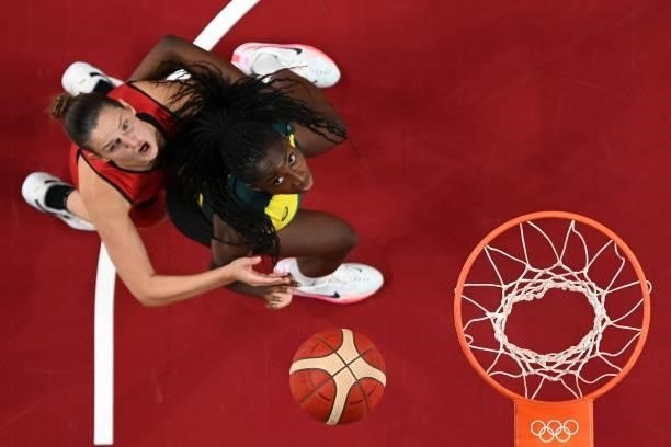 Australia's Ezi Magbegor and Belgium's Jana Raman look for the rebound in the women's preliminary round group C basketball match between Australia...
