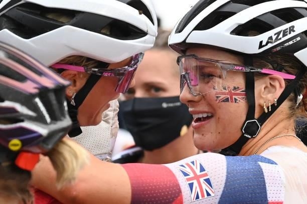 Britain's Evie Richards congratulates gold medallist Switzerland's Jolanda Neff after finishing the cycling mountain bike women's cross-country race...