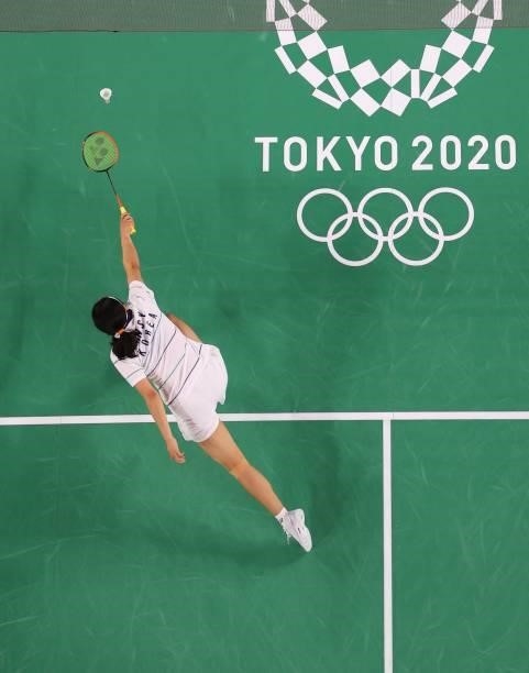 South Korea's An Se-young hits a shot to Nigeria's Dorcas Ajoke Adesokan in their women's singles badminton group stage match during the Tokyo 2020...