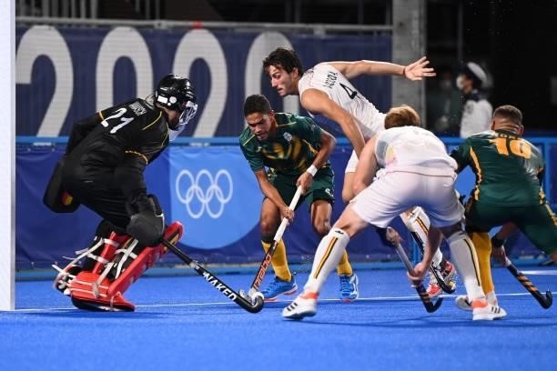 South Africa's Abdud Dayaan Cassiem and Belgium's Arthur Van Doren vie for the ball during their men's pool B match of the Tokyo 2020 Olympic Games...