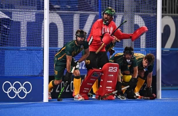 South Africa's goalkeeper Erasmus Pieterse and teammates defend their goal during a penalty corner in favour of Belgium during their men's pool B...