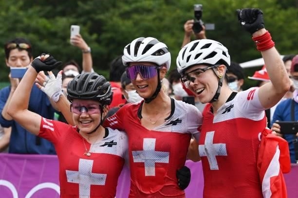 Silver medallist Switzerland's Sina Frei, gold medallist Switzerland's Jolanda Neff and bronze medallist Switzerland's Linda Indergand celebrate...