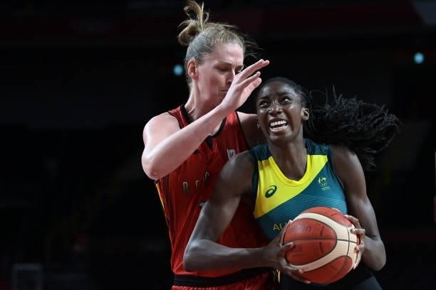 Australia's Ezi Magbegor runs with the ball past Belgium's Emma Meesseman in the women's preliminary round group C basketball match between Australia...