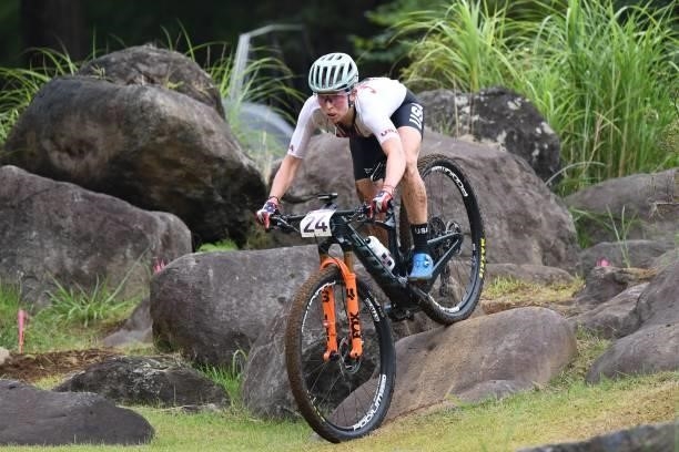 S Erin Huck rides in the cycling mountain bike women's cross-country event during the Tokyo 2020 Olympic Games at the Izu MTB Course in Izu on July...