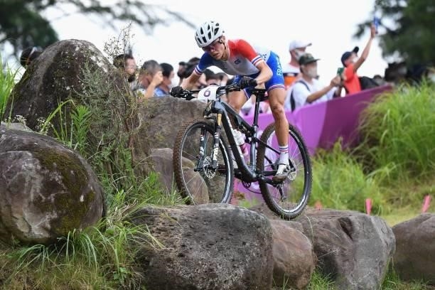 France's Loana Lecomte competes in the cycling mountain bike women's cross-country event during the Tokyo 2020 Olympic Games at the Izu MTB Course in...