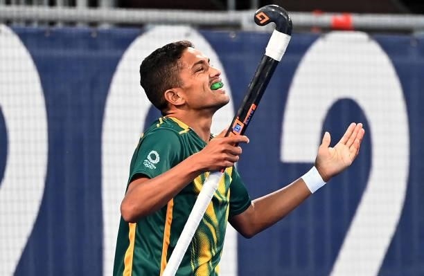 South Africa's Abdud Dayaan Cassiem celebrates after scoring against Belgium during their men's pool B match of the Tokyo 2020 Olympic Games field...