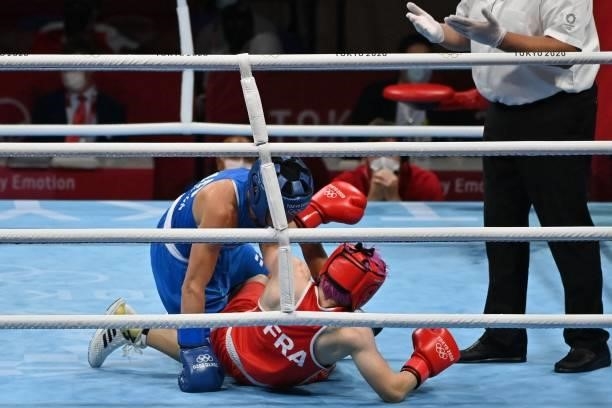 France's Maiva Hamadouche and Finland's Mira Marjut Johanna Potkonen fight during their women's light preliminaries boxing match during the Tokyo...