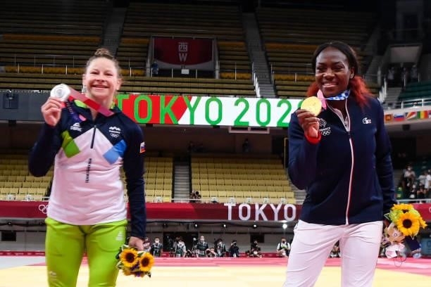 Silver medallist Slovenia's Tina Trstenjak and gold medallist France's Clarisse Agbegnenou celebrate during the medal ceremony for the judo women's...