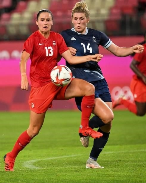 Canada's forward Evelyne Viens fights for the ball Britain's defender Millie Bright during the Tokyo 2020 Olympic Games women's group E first round...