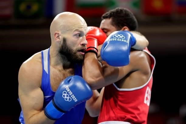 Kazakhstan's Vassiliy Levit and Spain's Enmanuel Reyes Pla fight during their men's heavy preliminaries round of 16 boxing match during the Tokyo...