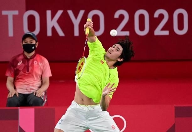 Sweden's Felix Burestedt hits a shot to Canada's Brian Yang in their men's singles badminton group stage match during the Tokyo 2020 Olympic Games at...