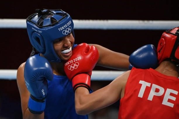 Chinese Taipei's Shih-Yi Wu and Sweden's Agnes Alexiusson fight during their women's light preliminaries boxing match during the Tokyo 2020 Olympic...
