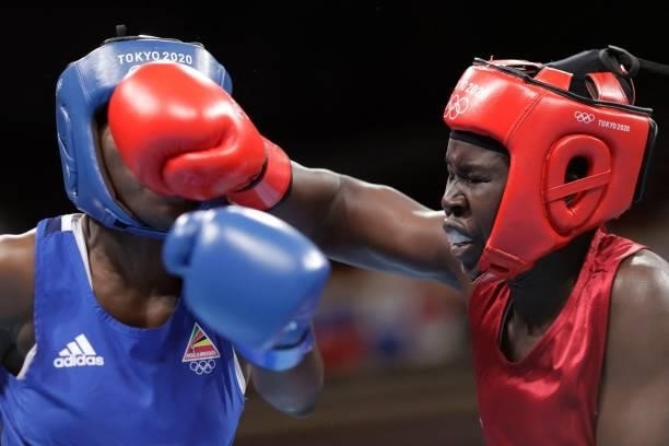 Kenya's Elizabeth Akinyi and Mozambique's Acinda Helena Panguana fight during their women's welter preliminaries round of 16 boxing match during the...