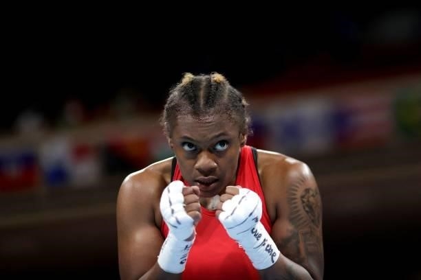 S Oshae Lanae Jones celebrates after winning against Mexico's Brianda Tamara Cruz Sandoval at the end of their women's welter preliminaries round of...