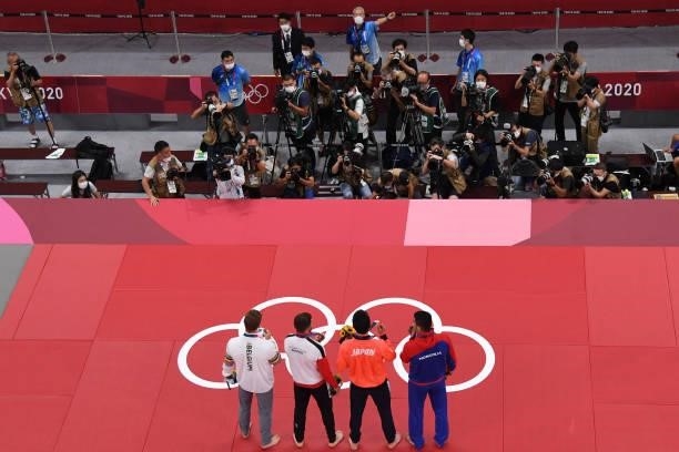 Silver medallist Mongolia's Saeid Mollaei, gold medallist Japan's Takanori Nagase and bronze medallists Austria's Shamil Borchashvili and Belgium's...