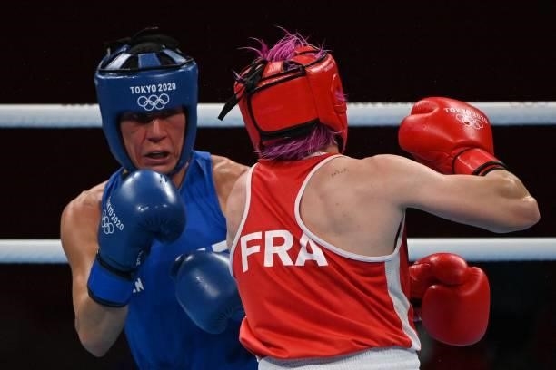 France's Maiva Hamadouche and Finland's Mira Marjut Johanna Potkonen fight during their women's light preliminaries boxing match during the Tokyo...
