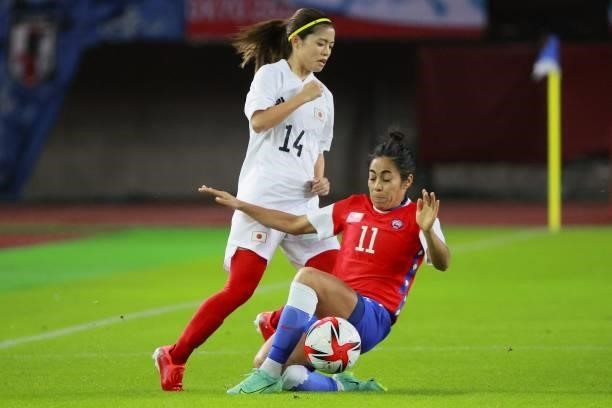 Chile's midfielder Yessenia Lopez fights for the ball with Japan's midfielder Yui Hasegawa during the Tokyo 2020 Olympic Games women's group E first...