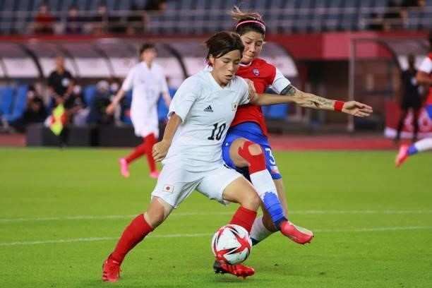 Japan's forward Mana Iwabuchi fights with the ball with Chile's defender Carla Guerrero during the Tokyo 2020 Olympic Games women's group E first...