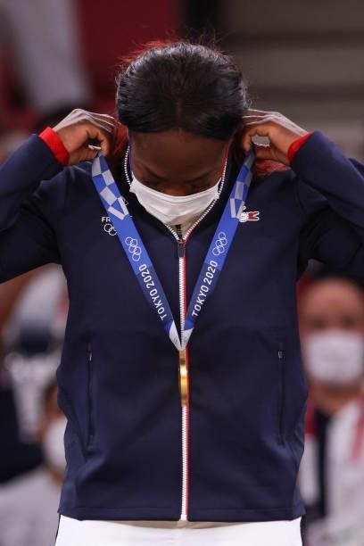 Gold medallist France's Clarisse Agbegnenou celebrates during the medal ceremony for the judo women's -63kg contest during the Tokyo 2020 Olympic...