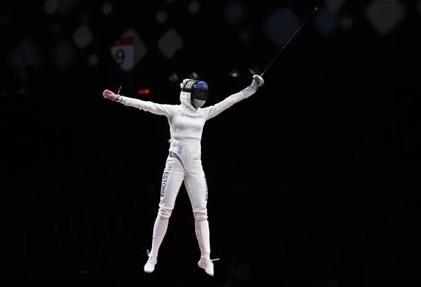Estonia's Katrina Lehis celebrates scoring the final point against South Korea's Choi Injeong in the womens team epee gold medal bout during the...