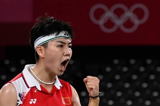 China's Li Yinhui reacts after a point next to China's Du Yue in their women's doubles badminton group stage match against South Korea's Lee So-hee...