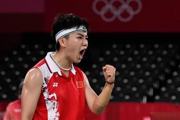 China's Li Yinhui reacts after a point next to China's Du Yue in their women's doubles badminton group stage match against South Korea's Lee So-hee...