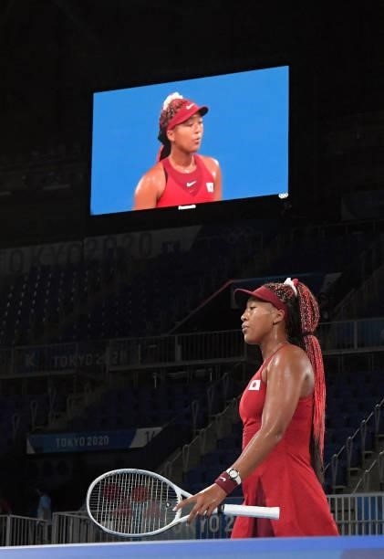 Japan's Naomi Osaka competes against Czech Republic's Marketa Vondrousova during their Tokyo 2020 Olympic Games women's singles third round tennis...