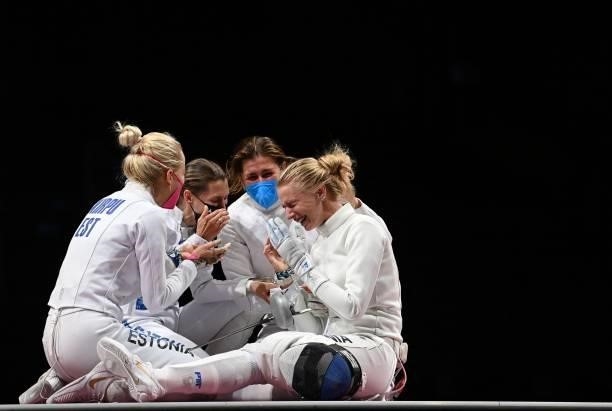 Estonia's Katrina Lehis celebrates with her teamates after winning against South Korea's Choi Injeong in the womens team epee gold medal bout during...