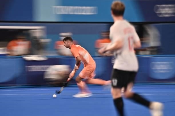 Netherlands' Robbert Kemperman carries the ball during the men's pool B match of the Tokyo 2020 Olympic Games field hockey competition against...