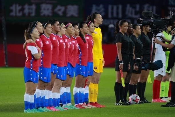 The Chil team line up to sing their national anthem before the Tokyo 2020 Olympic Games women's group E first round football match between Chile and...