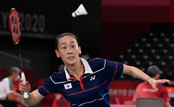 South Korea's Lee So-hee hits a shot next to South Korea's Shin Seung-chan in their women's doubles badminton group stage match against China's Li...