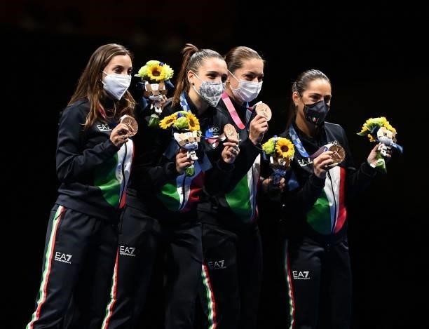 Bronze medallist Italy's fencers celebrates during the medal ceremony for the womens team epee during the Tokyo 2020 Olympic Games at the Makuhari...