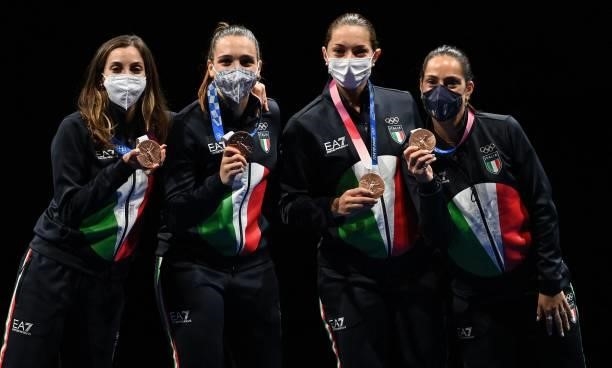 Bronze medallist Italy's fencers celebrates during the medal ceremony for the womens team epee during the Tokyo 2020 Olympic Games at the Makuhari...
